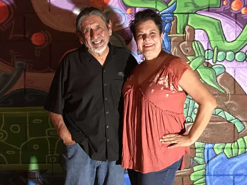 Image: Martin Moreno and Emily Costello (pictured with a mural by Edgar Fernandez) will work together on creating light rail art.