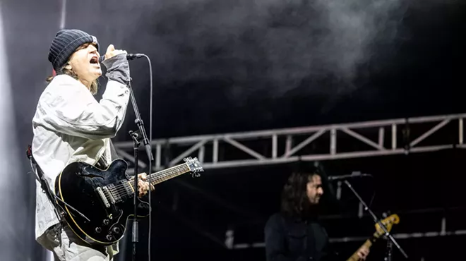 A man performs onstage.