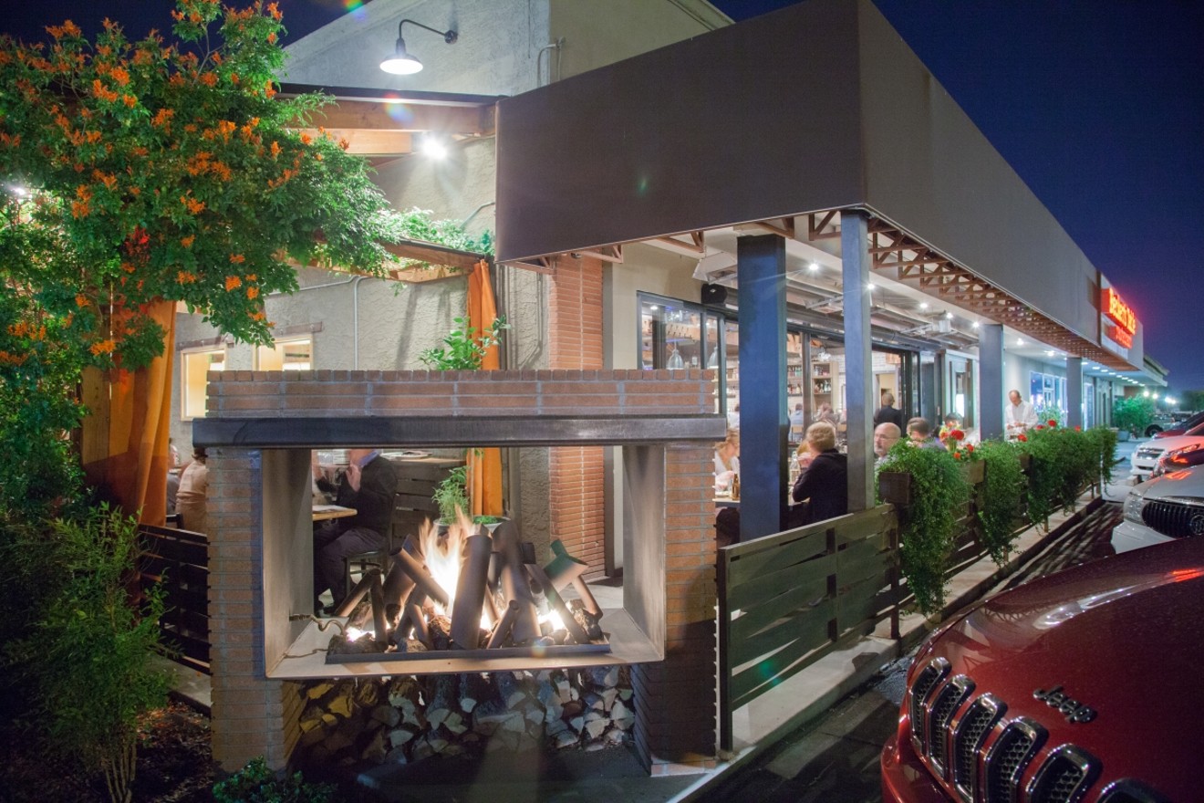 A fireplace ensures you won't get cold while dining outside on Beckett's Table's patios.