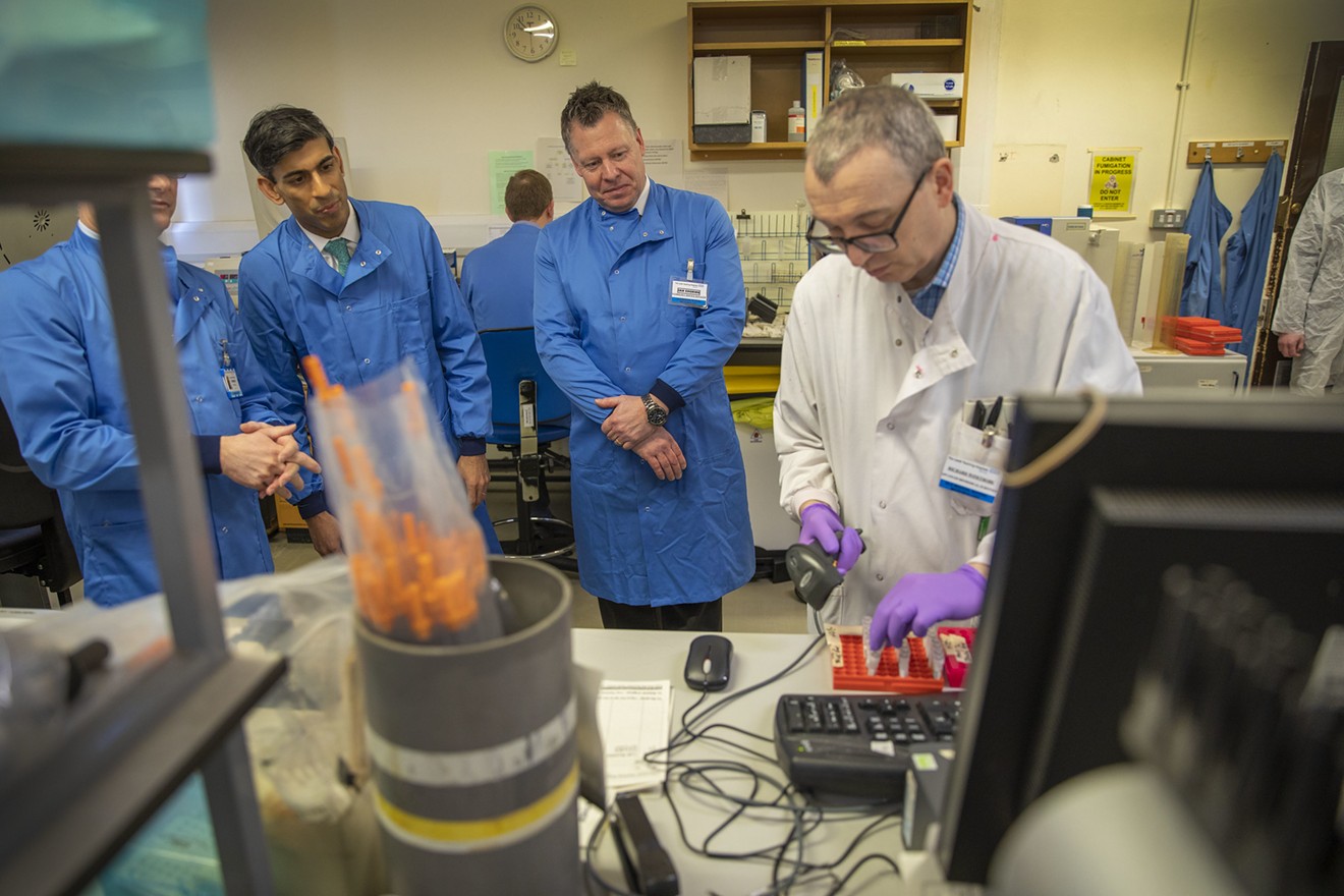 A British politician visits a coronavirus testing laboratory in Leeds, England.