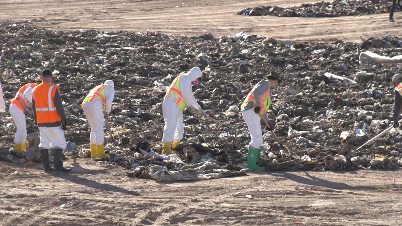 Volunteers search a city landfill near Gila Bend for Christine Mustafa's body.