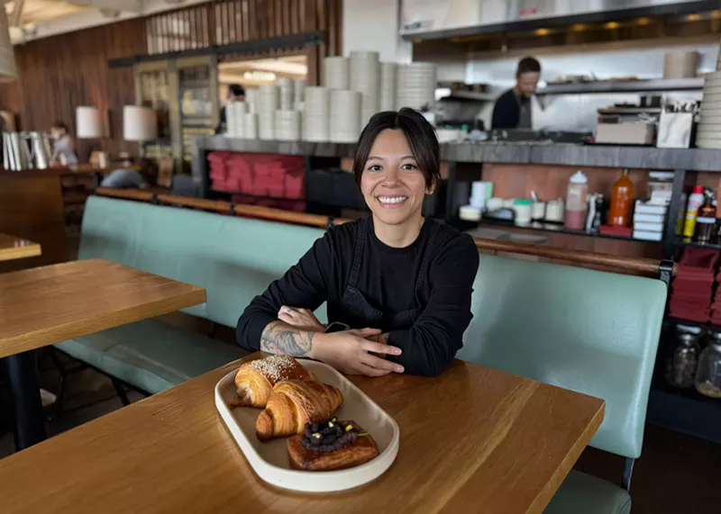 Image: Pastry chef Crystal Kass sitting at a booth in Valentine.