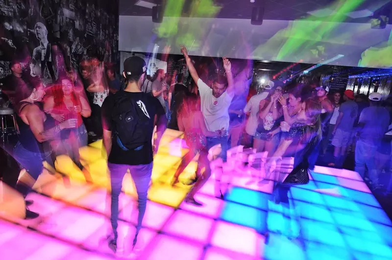 Image: The dancefloor lights up at Stardust Pinbar.