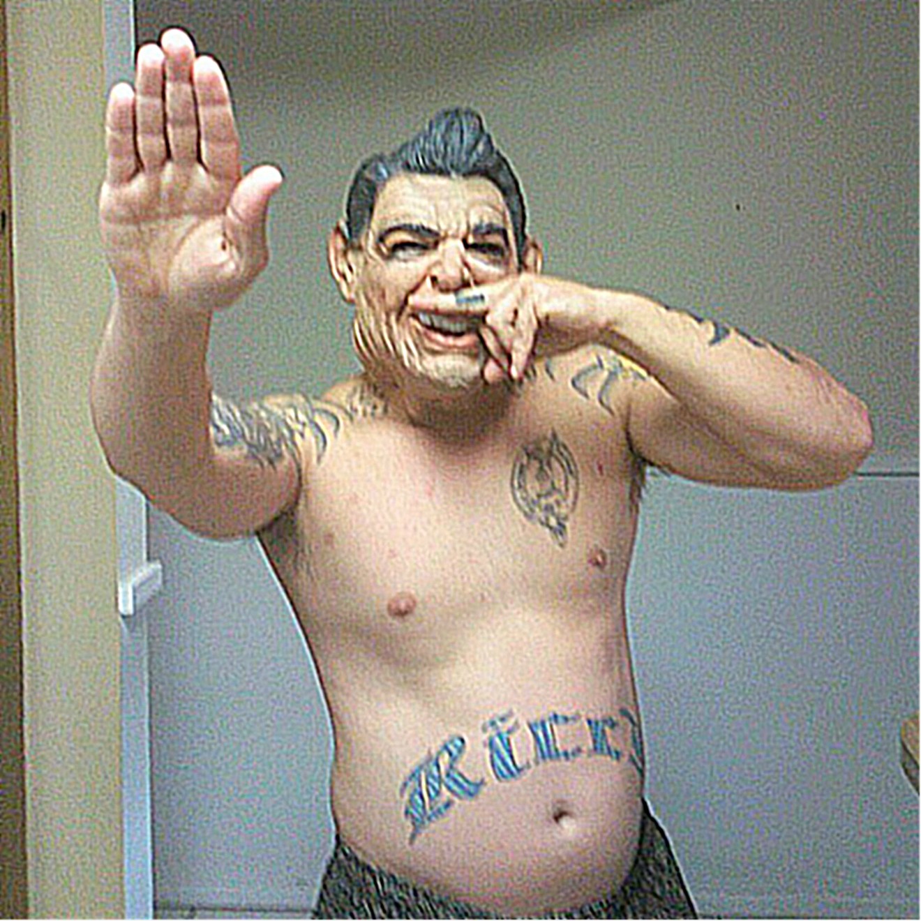Ricci's attorney Jennifer Willmott says Ricci is "not a neo-Nazi," but his tattoos — the Hitler 'stache on his middle finger and the SS bolts near his neck, among others — argue otherwise.