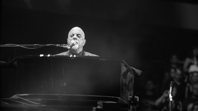 Billy Joel sings and plays piano.