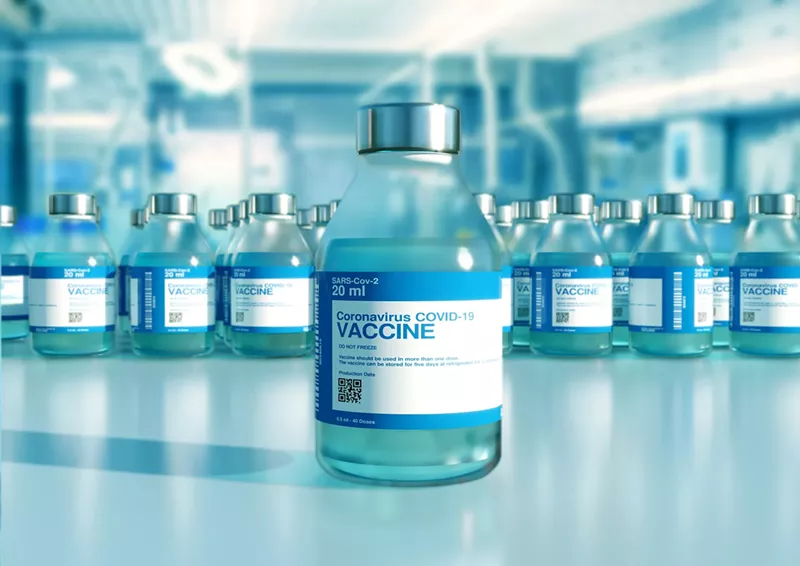 Image: The county says that 553 COVID-19 vaccine doses have been wasted since it began its program. The state says it has wasted zero doses.