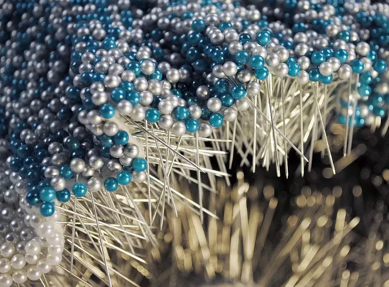 Image: Angela Ellsworth, Pantaloncini: Work No. 069 (Emma) (detail) 2017, 52,692 pearl corsage pins and colored dress pins, fabric, steel, 28 x 38 x 17 inches4 / 21.