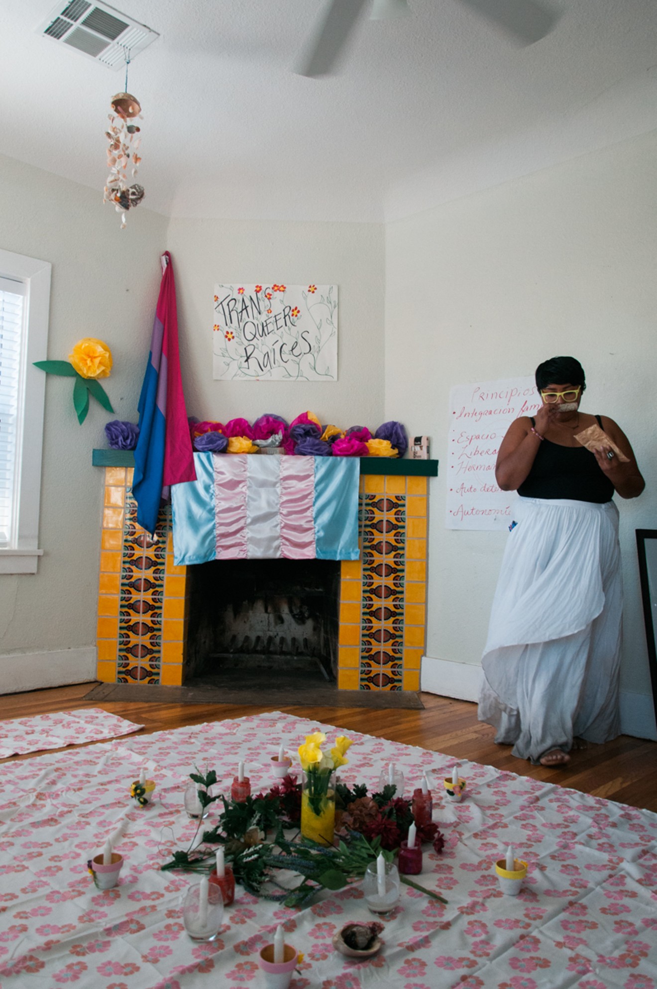 Cynthia Domenzain, 23, from Phoenix, looks over preparations made for Trans Queer Pueblo's healing circle.