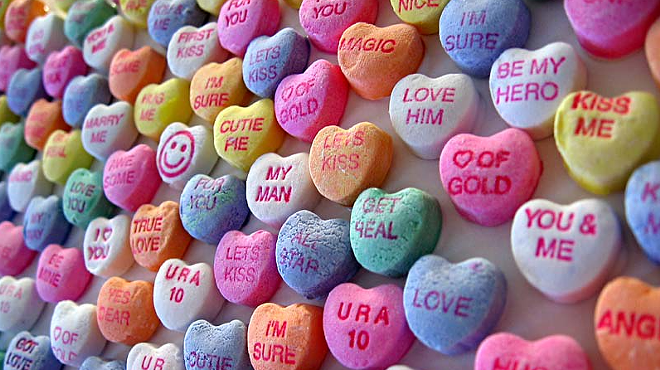 Rows of conversation hearts candy.