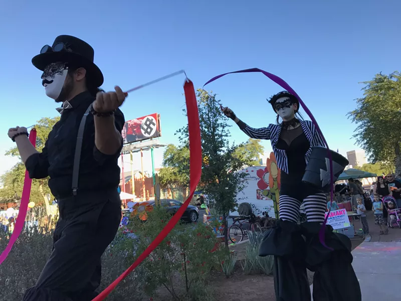 Image: Stilt-walkers strolling along Grand Avenue.