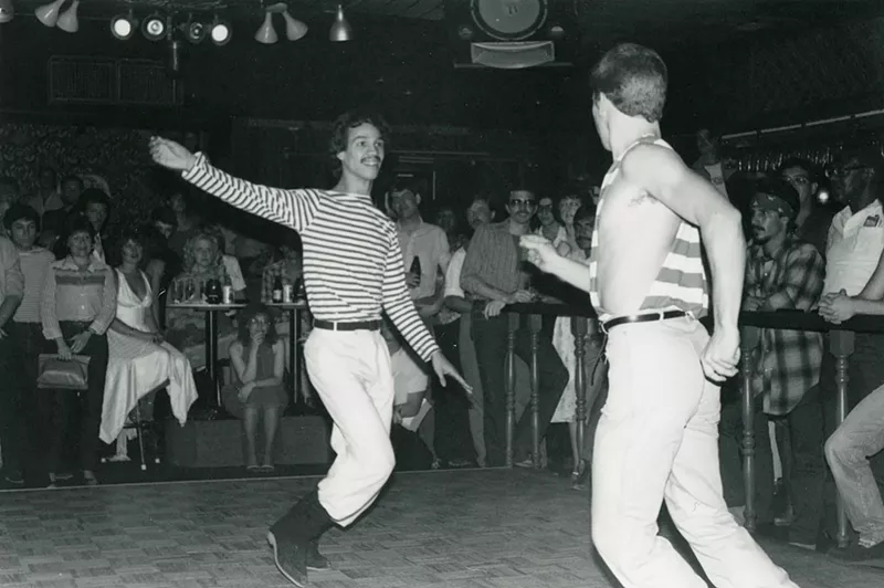 Image: Two men compete in a dance contest in the early 1980s at Charlie's Phoenix, one of the Valley's longest-running LGBTQ bars.