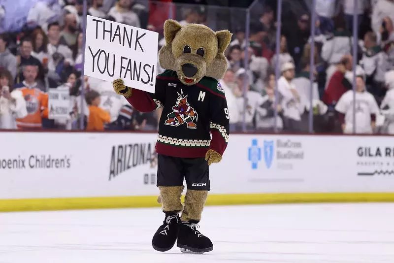 Image: the arizona coyotes mascot with a "thank you fans" sign