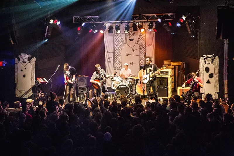 Image: AJJ are performing at a benefit show.