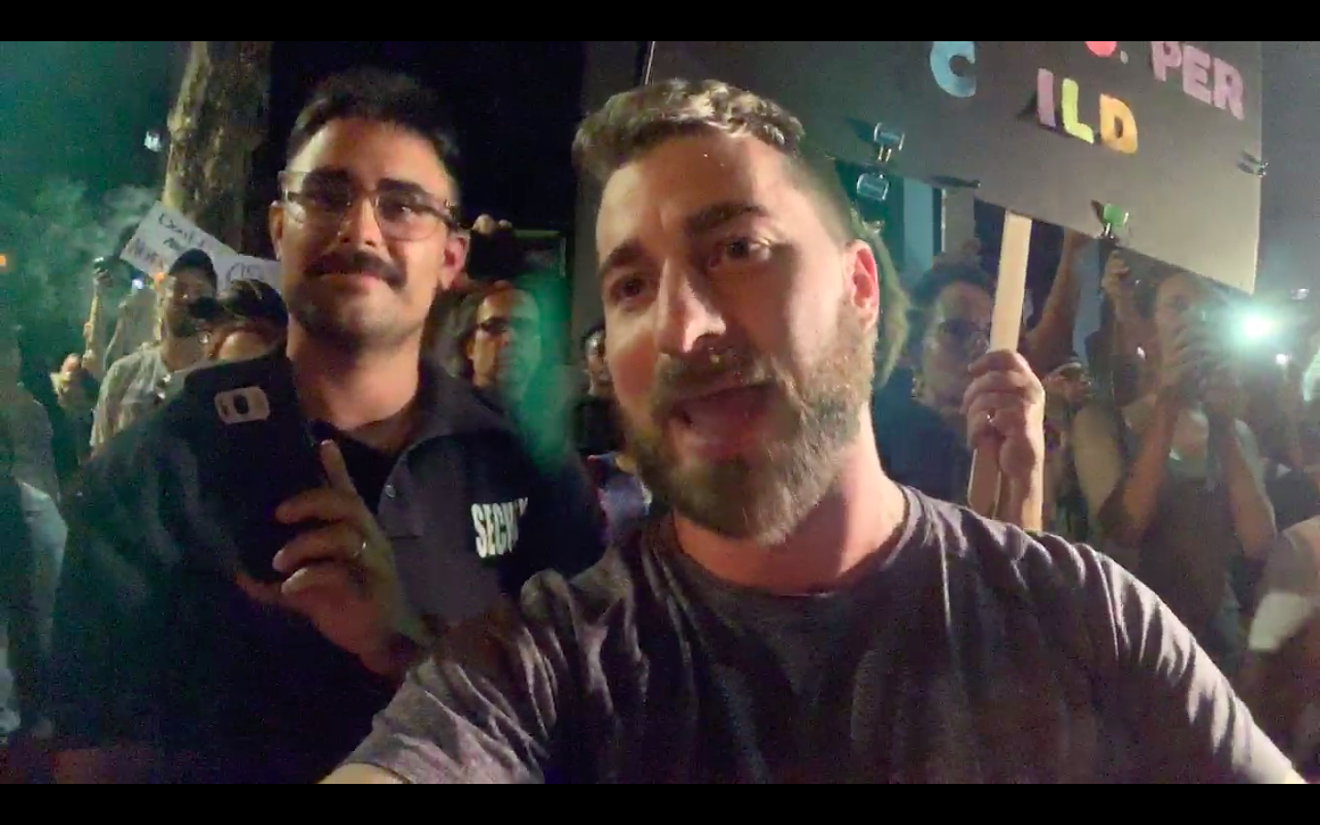 Tim Gionet (right) and his friend at Friday's ICE protest.