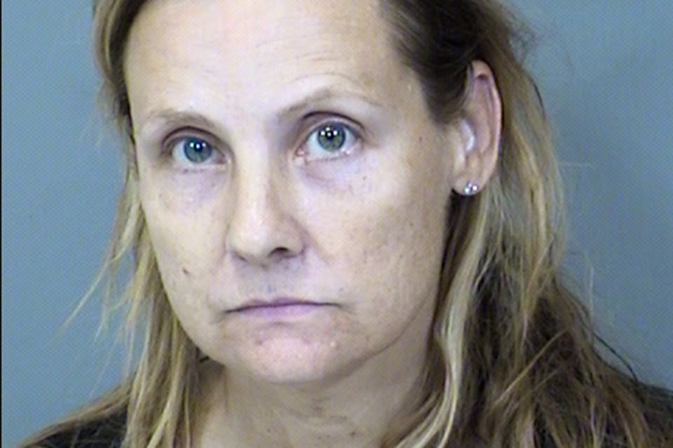 A mugshot of April McLaughlin, who faces 110 counts of animal cruelty.