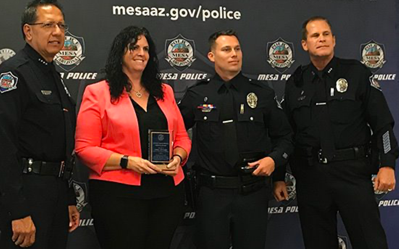 MCAO prosecutor April Sponsel receives an award from Mesa police in 2018.