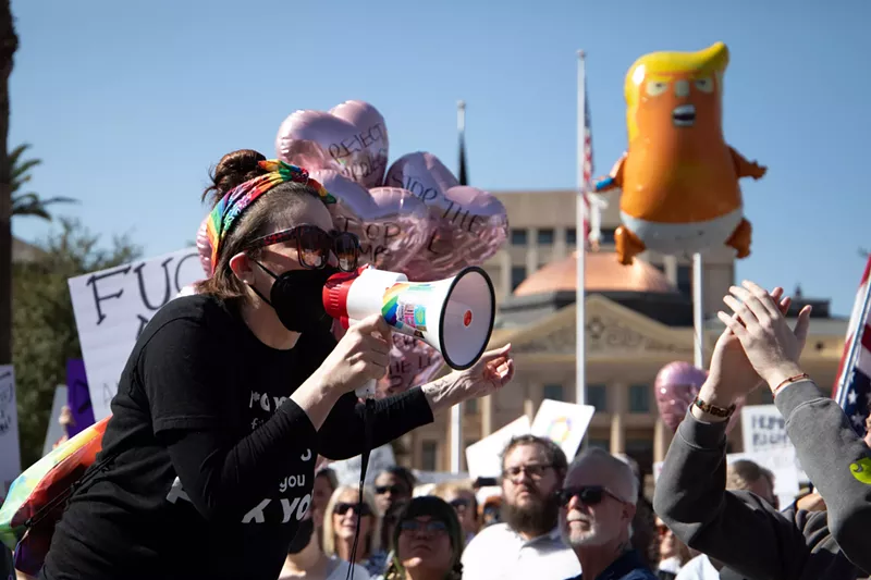 Image: Protestors spent hours hollering and chanting at the Arizona Capitol on Wednesday.