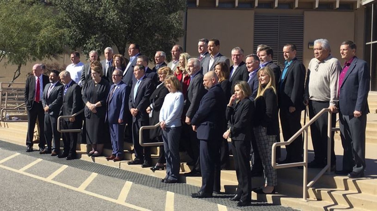 The negotiators of Arizona's Colorado River drought plan posed for a celebratory photo on Tuesday, February 19, 2019. But the plan's not done.