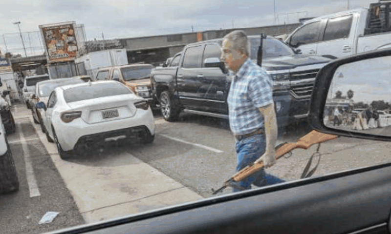 Mark Adams Prieto, photographed during an FBI investigation, is accused of firearms trafficking, possession of an unregistered firearm and the transfer of a firearm for use in a hate crime.