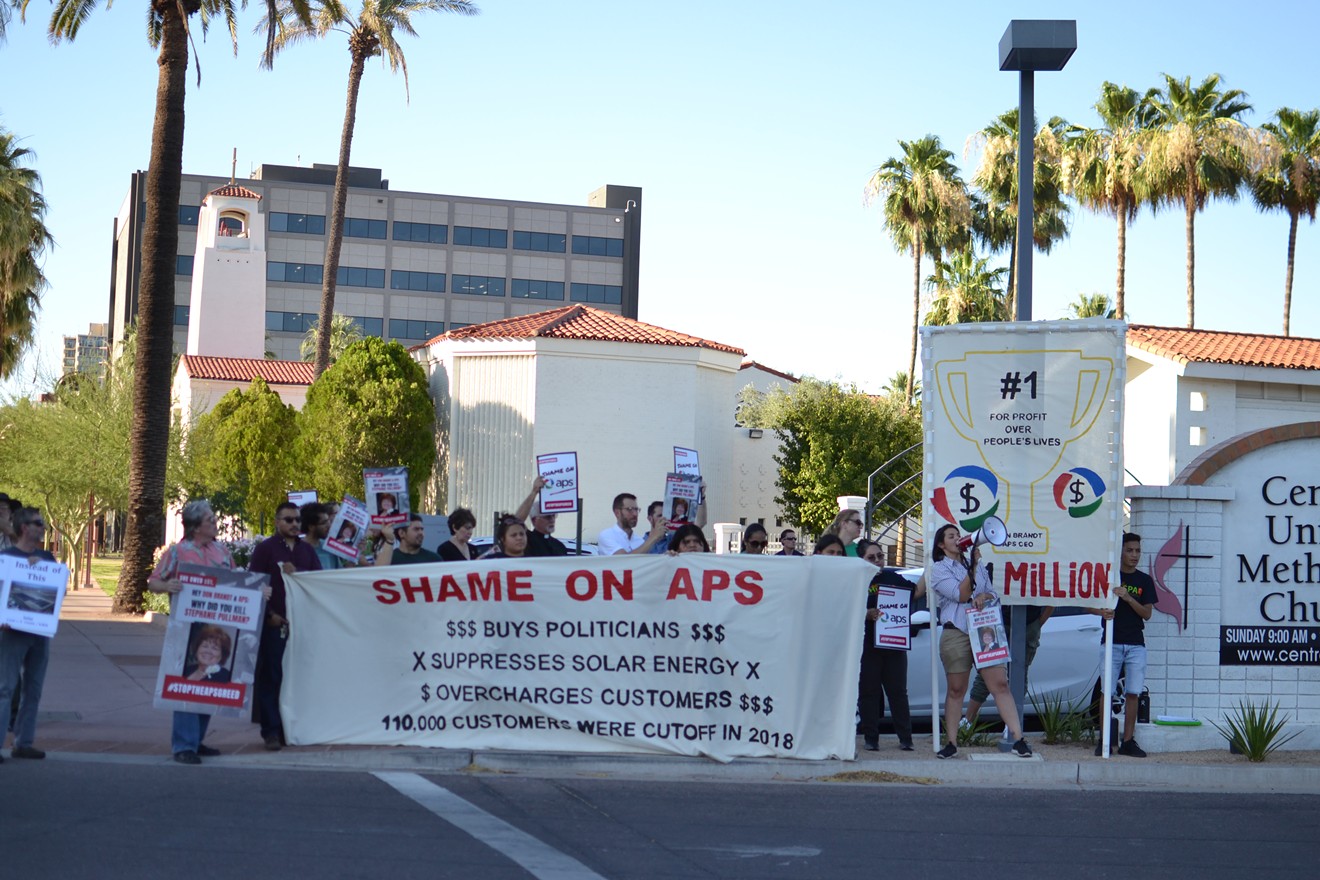 Protesters on June 20 rally against Arizona Public Service and the Corporation Commission.