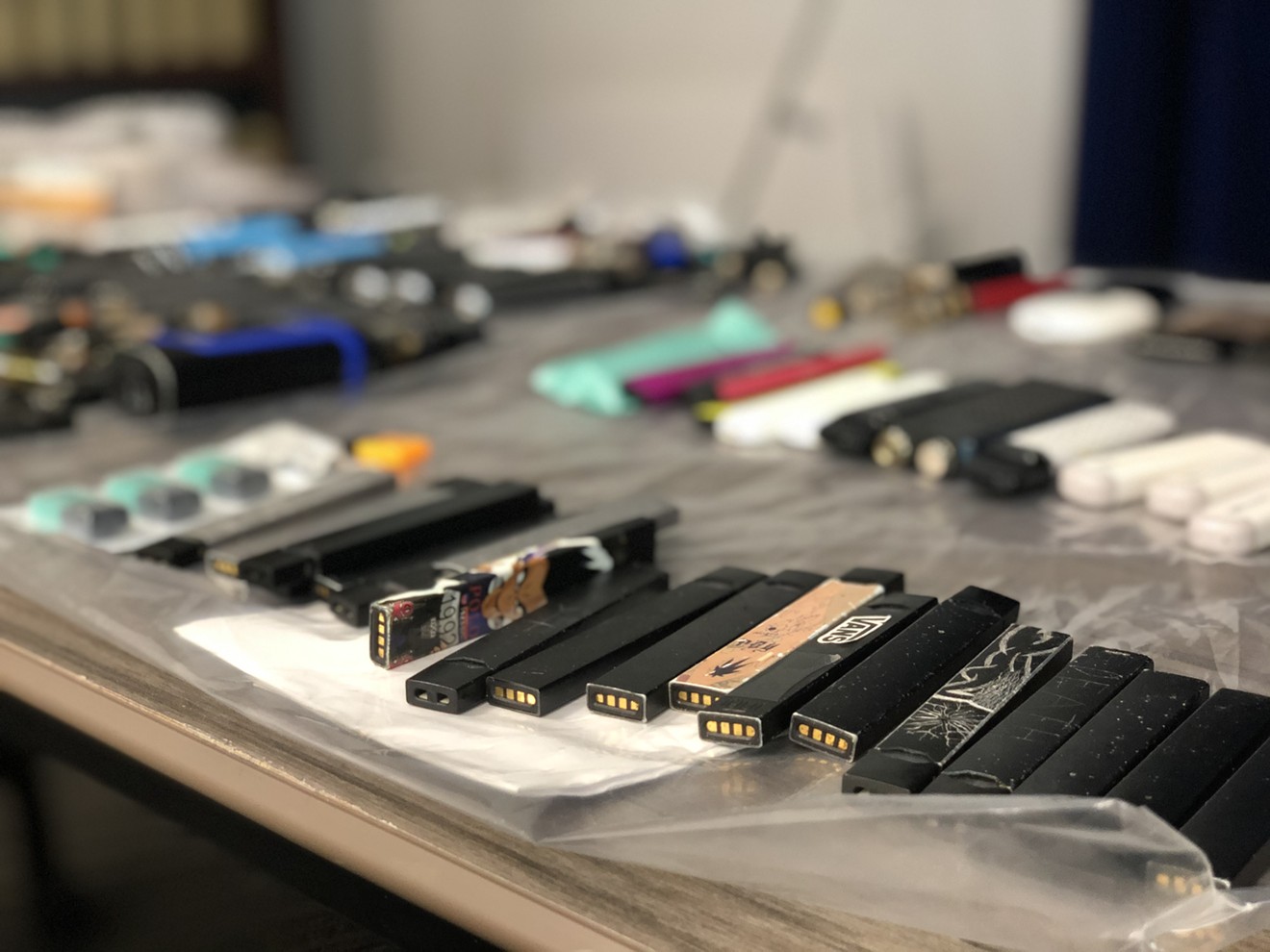 JUUL products confiscated from Arizona schools on display at the press conference on Tuesday.