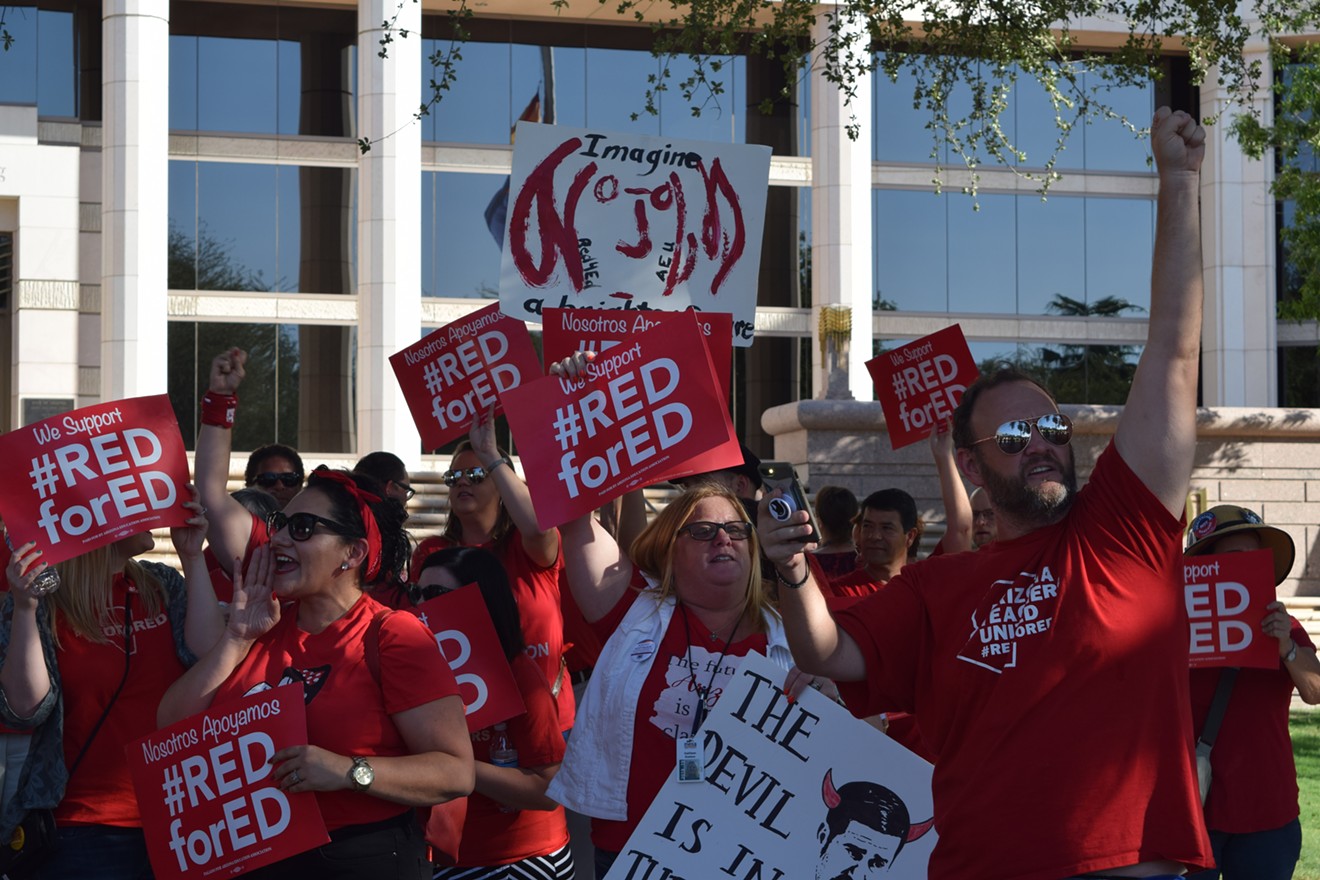 Educators and supporters gather at the Arizona Supreme Court on August 31 to protest a decision that kicked a school funding initiative off the ballot.
