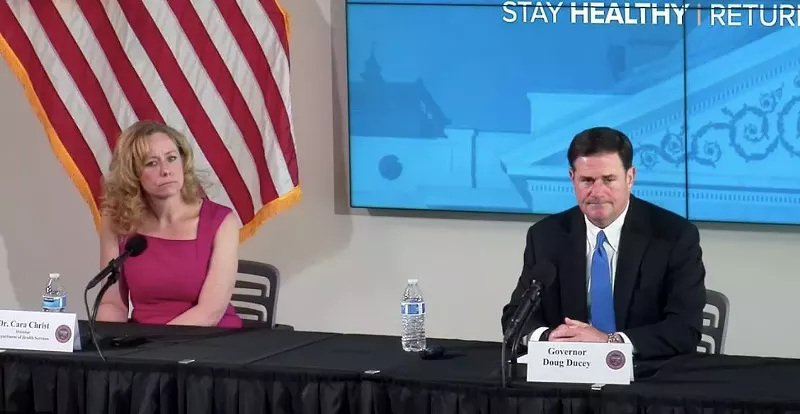 Image: Arizona Governor Doug Ducey and state health director Dr. Cara Christ discuss the state's reopening plans at a May 12 press conference.