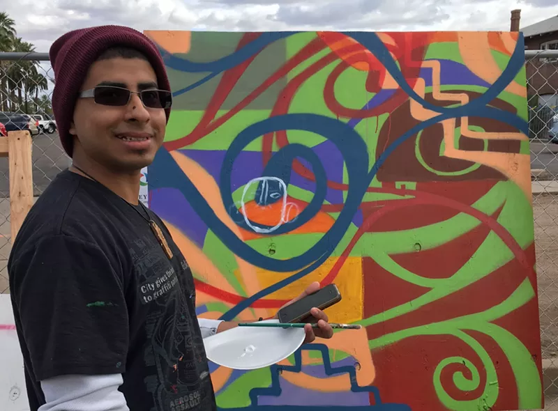 Image: Edgar Fernandez painting at Phoenix Festival of the Arts a few years back.