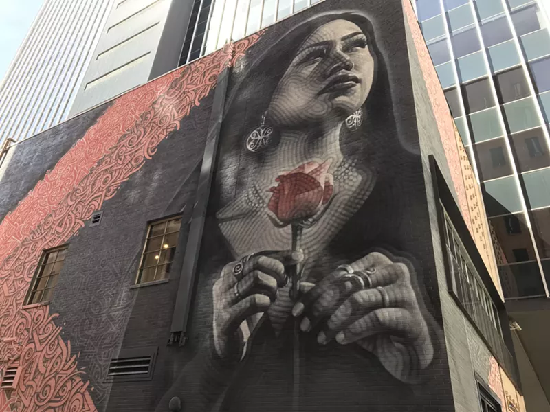 Image: Exploring the detailed line work by El Mac and Breeze in downtown Phoenix.