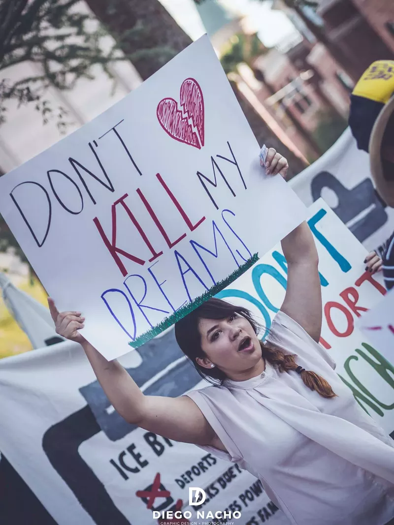 Image: Reyna Montoya protests the end of DACA in front of a local U.S. Immigration and Customs Enforcement building on Thursday, August 31.