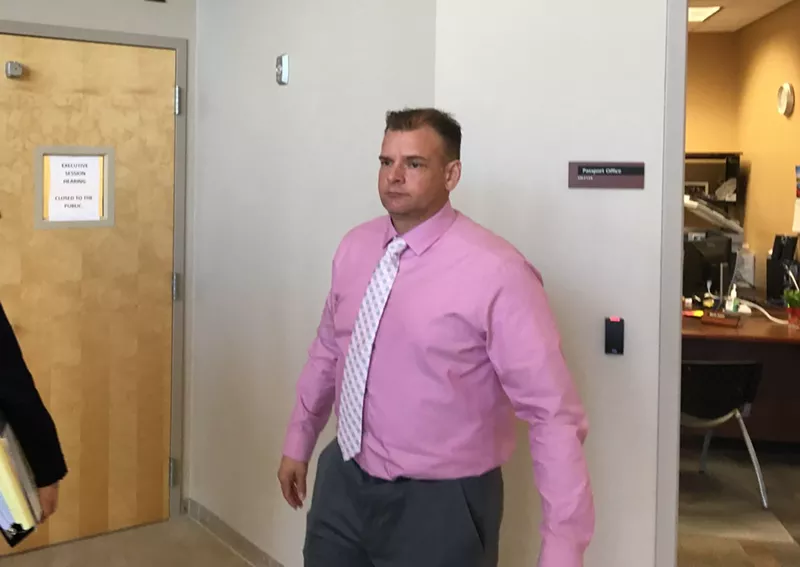 Image: Sergeant Sean Maas takes an intermission as he appeals his firing at Avondale City Hall.