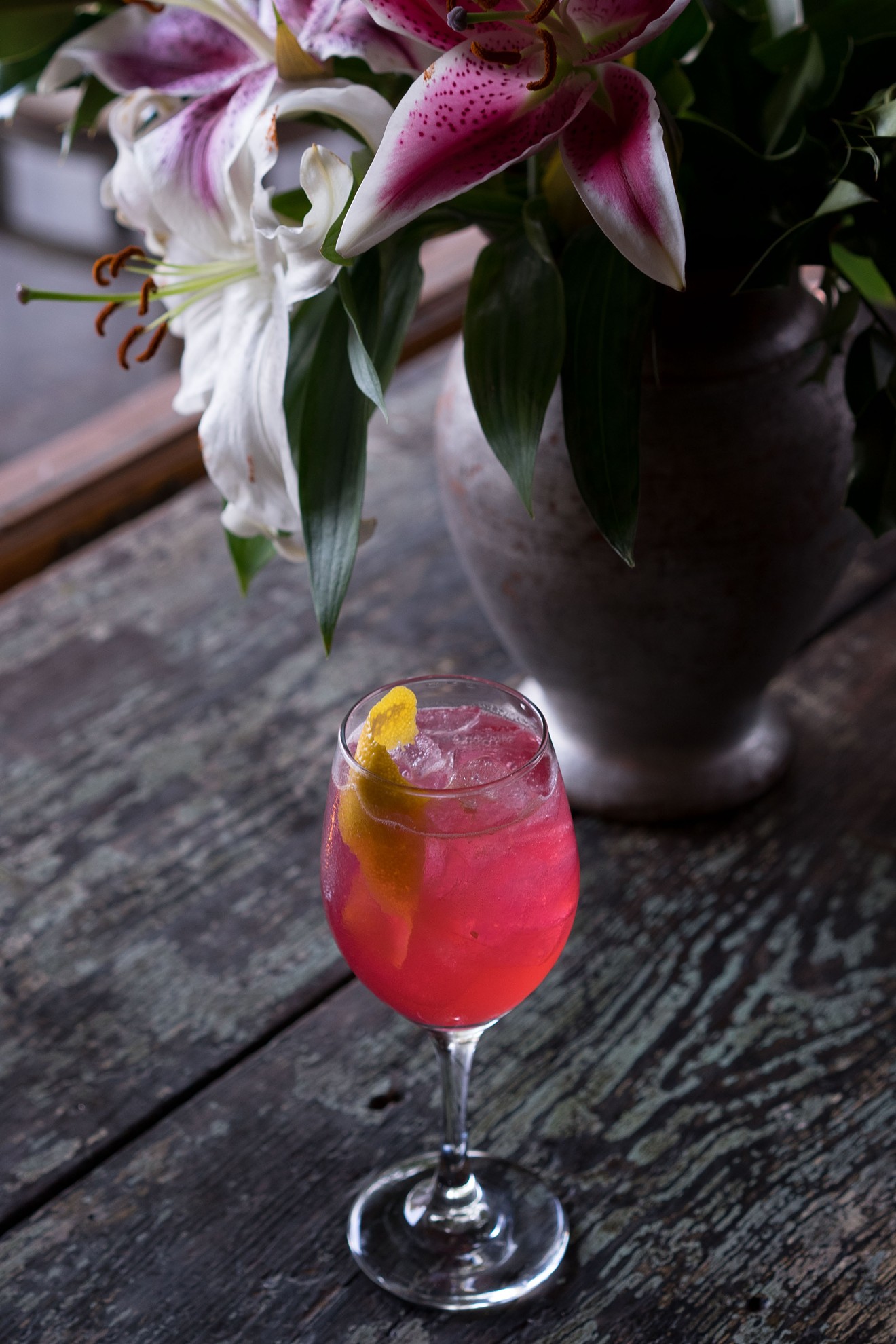 The Andie Walsh cocktail, built with house-made hibiscus syrup, is named for the Pretty In Pink character played by Molly Ringwald.