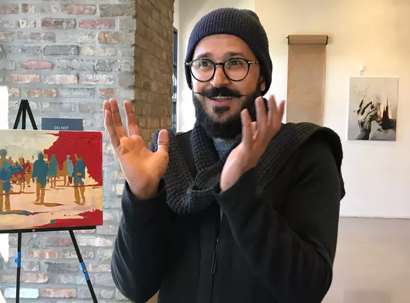 Image: Bassim Al-Shaker talks about his work.