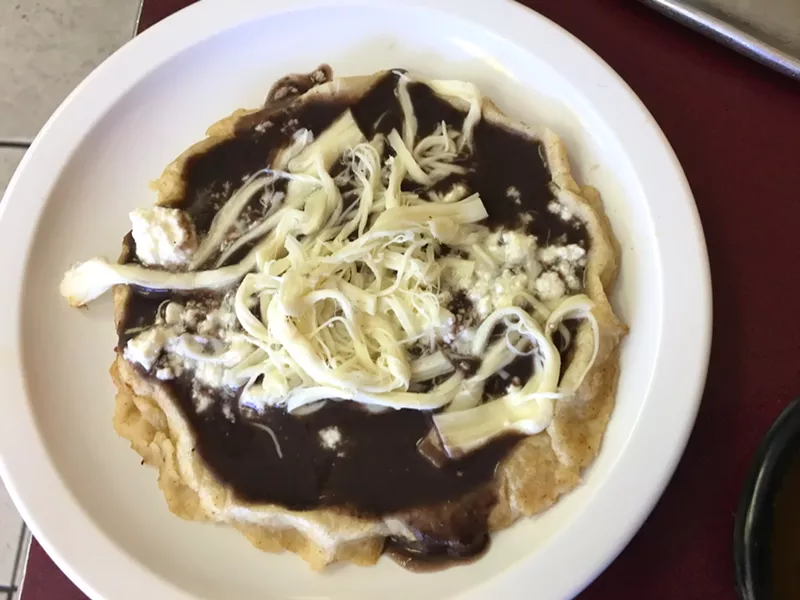Image: A memela with lots of cheese.