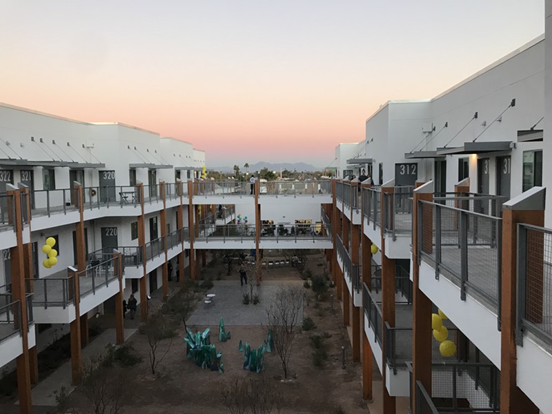 The sun sets over Mesa Artspace Lofts during January's grand opening event.
