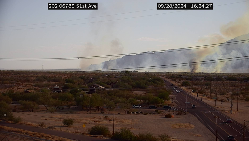 Arizona Department of Transportation cameras show the brush fire burning off Loop 202 in the Gila River Indian Community.