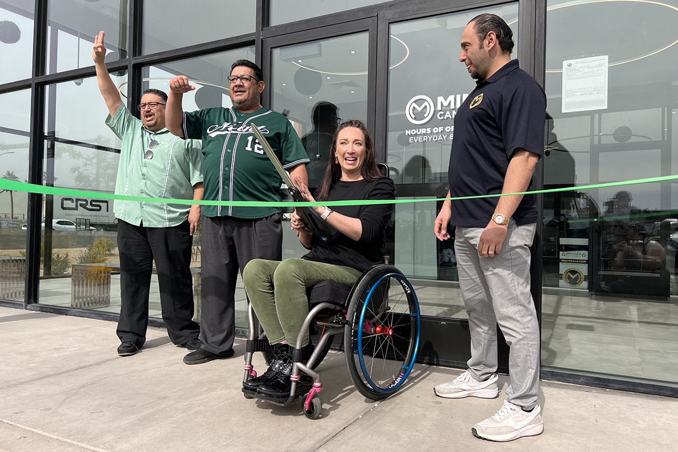 Six-time Olympic champion swimmer and cannabis patient and advocate Amy Van Dyken-Rouen cut the green ribbon to officially open Mint's West Valley location.