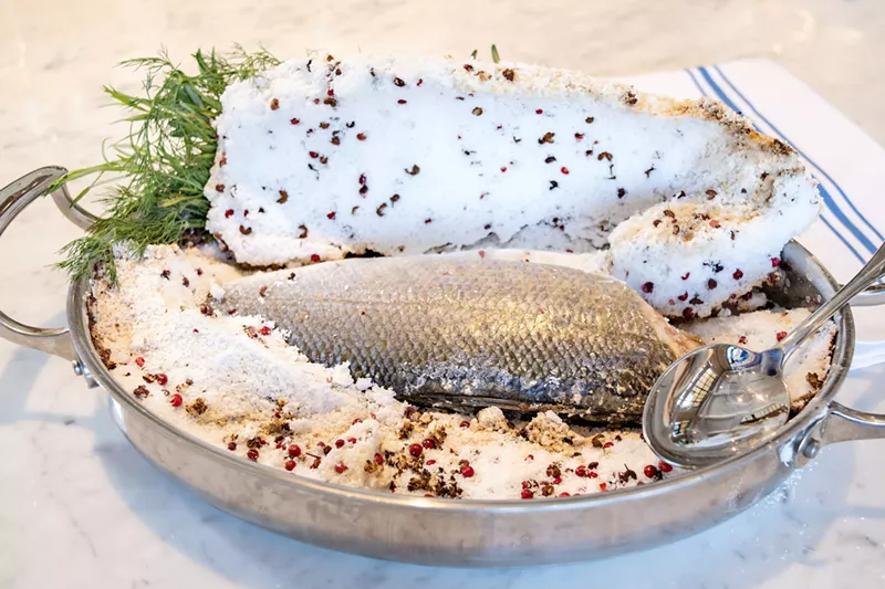 Image: Whole branzino cooked in a salt crust.