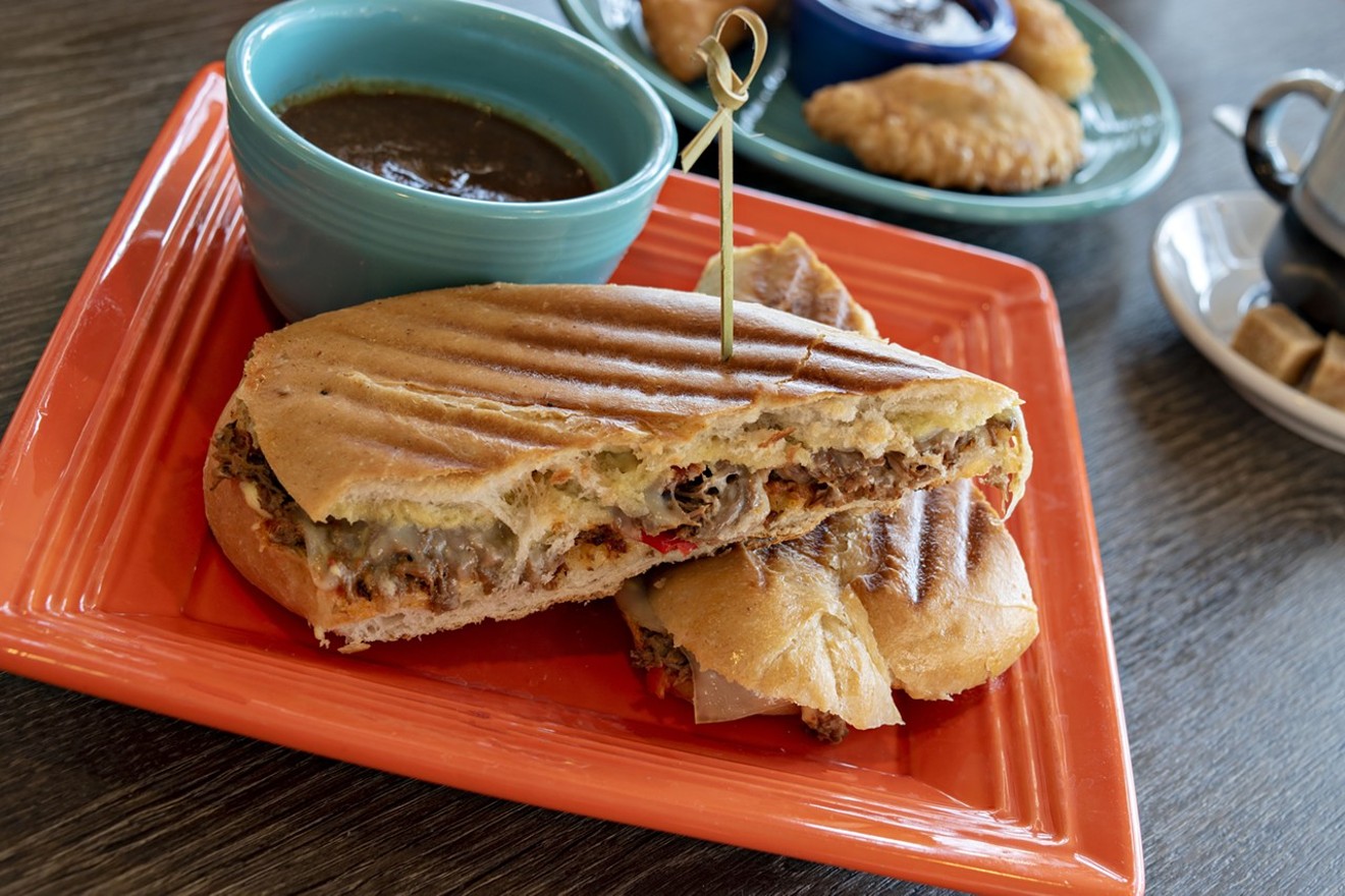 Ropa vieja French dip sandwich with a side of jerk sauce from Little Cay.