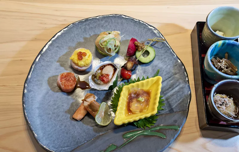 Image: A mixed plate of seafood bites, including jellyfish (left) and ShinBay's opening trio (right).