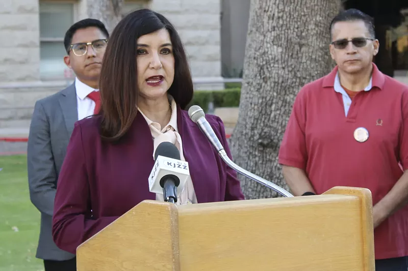 Image: State Sen. Eva Diaz speaking at a podium.