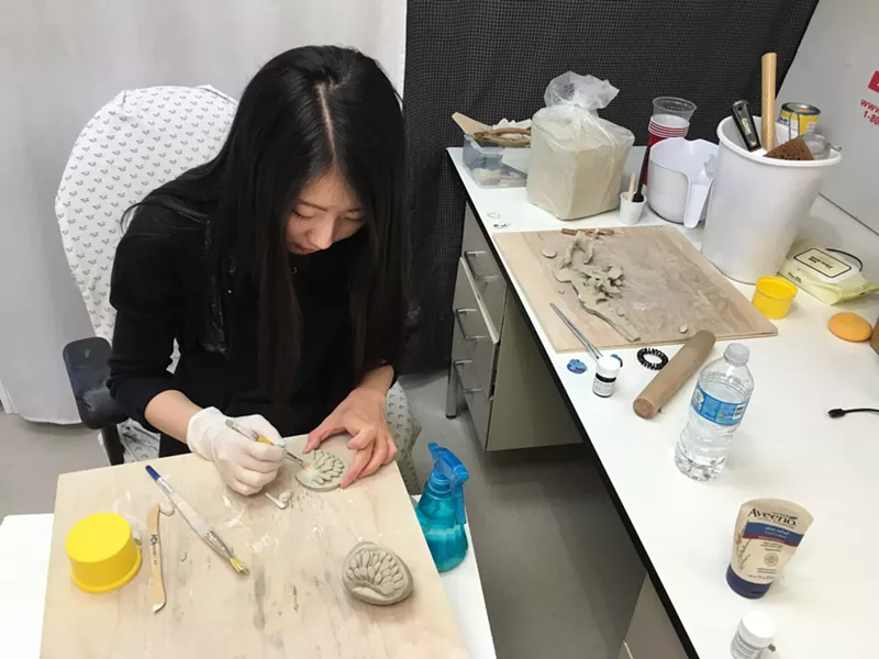 Image: Hakyoung Kim doing a demonstration of her ceramics technique during the 2016 ASU Ceramic Studio Tour.