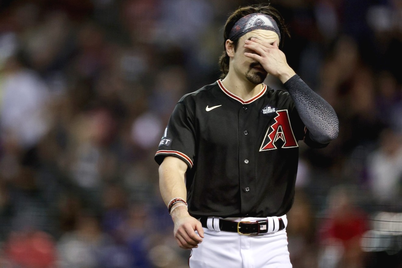 Corbin Carroll of the Arizona Diamondbacks reacts after grounding out in the fifth inning against the Texas Rangers. The D-backs went on to lose the game 11-7 on Tuesday.