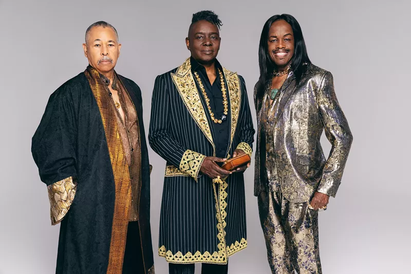 Image: Three Black musicians in stage clothing.