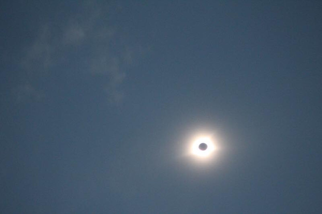 No, there isn't really a permanent "dark side" of the moon, as can be visualized in this photo of last year's solar eclipse.