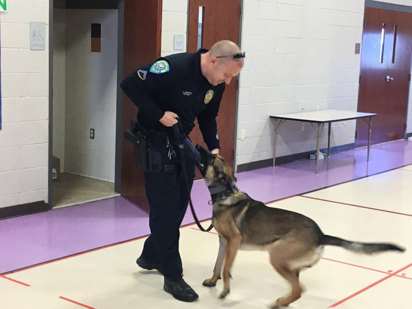 Officer Griffith shows off the skills of K-9 officer Narco in May 2017 at Four Peaks Elementary School, seven months after the dog allegedly attacked his daughter at home.