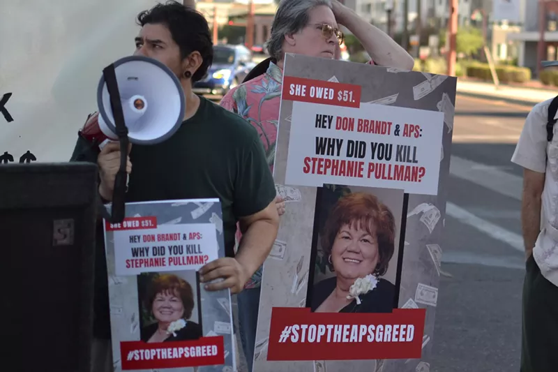 Image: People protest the death of APS customer Stephanie Pullman. The utility cut her power on a 107-degree day last September.