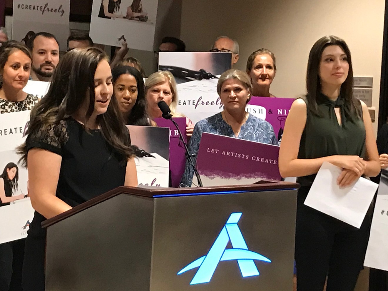 Artist Brianna Koski (at podium) and calligrapher Joanna Duka (right) talk about the ruling at Alliance Defending Freedom's Scottsdale office.