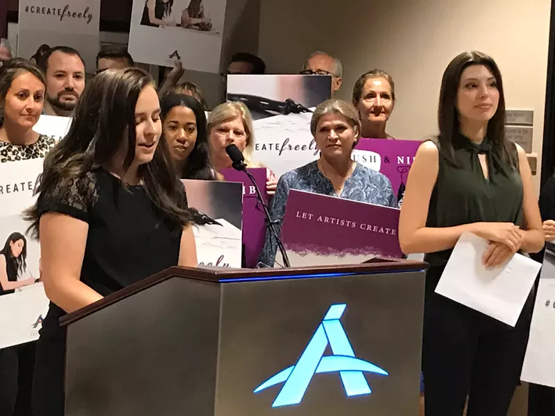 Image: Artist Brianna Koski (at podium) and calligrapher Joanna Duka (right) talk about the ruling at Alliance Defending Freedom's Scottsdale office.