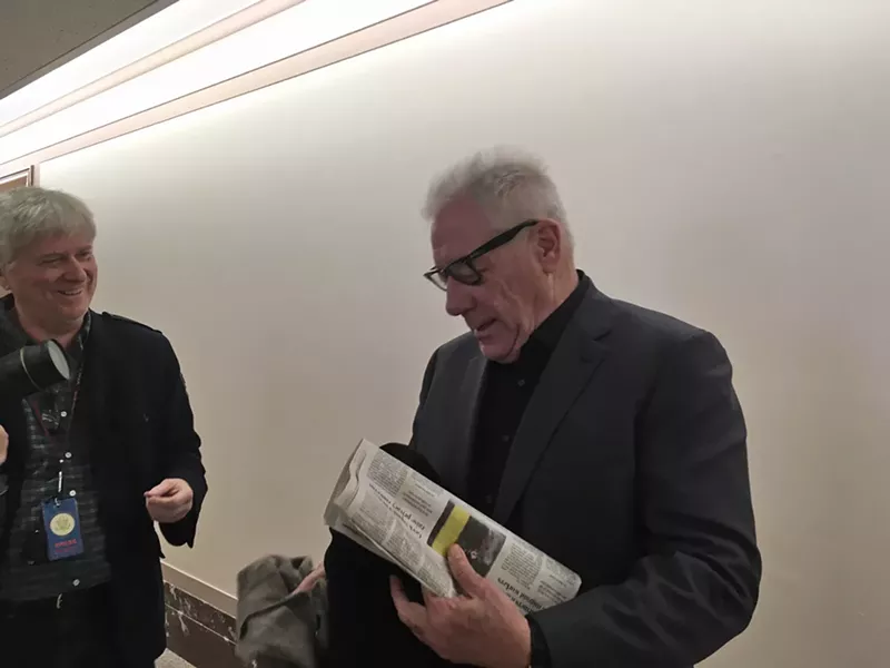 Image: New Times co-founder and former owner Michael Lacey (right) jousted with journalists after being dismissed by the U.S. Senate's Permanent Subcommittee on Investigations on Tuesday, January 10.